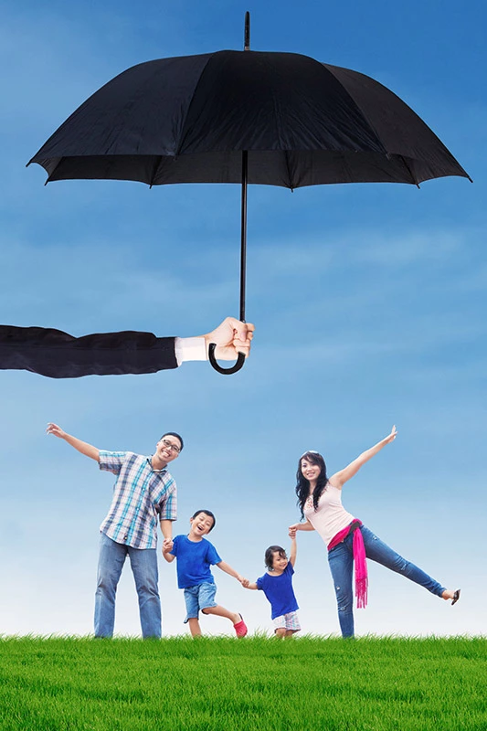 family standing under umbrella | smart health insurance portland
