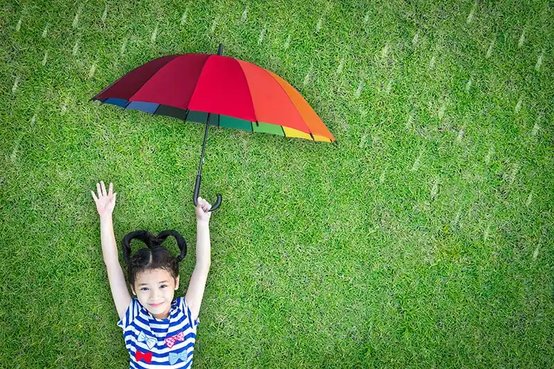 Smart Health Jeff Klein Girl in Grass with Umbrella