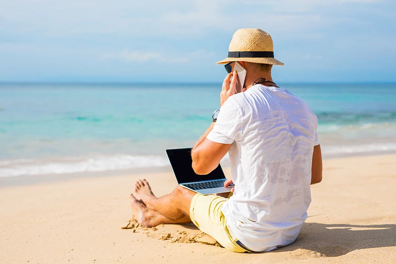 Smart Health Insurance Self Employed man working at the beach